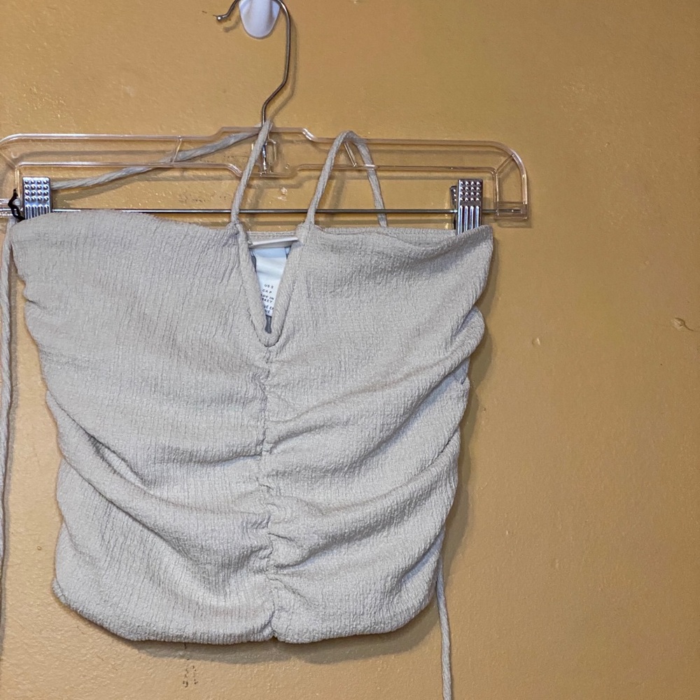 Halter neck crop top with a v detail at the chest